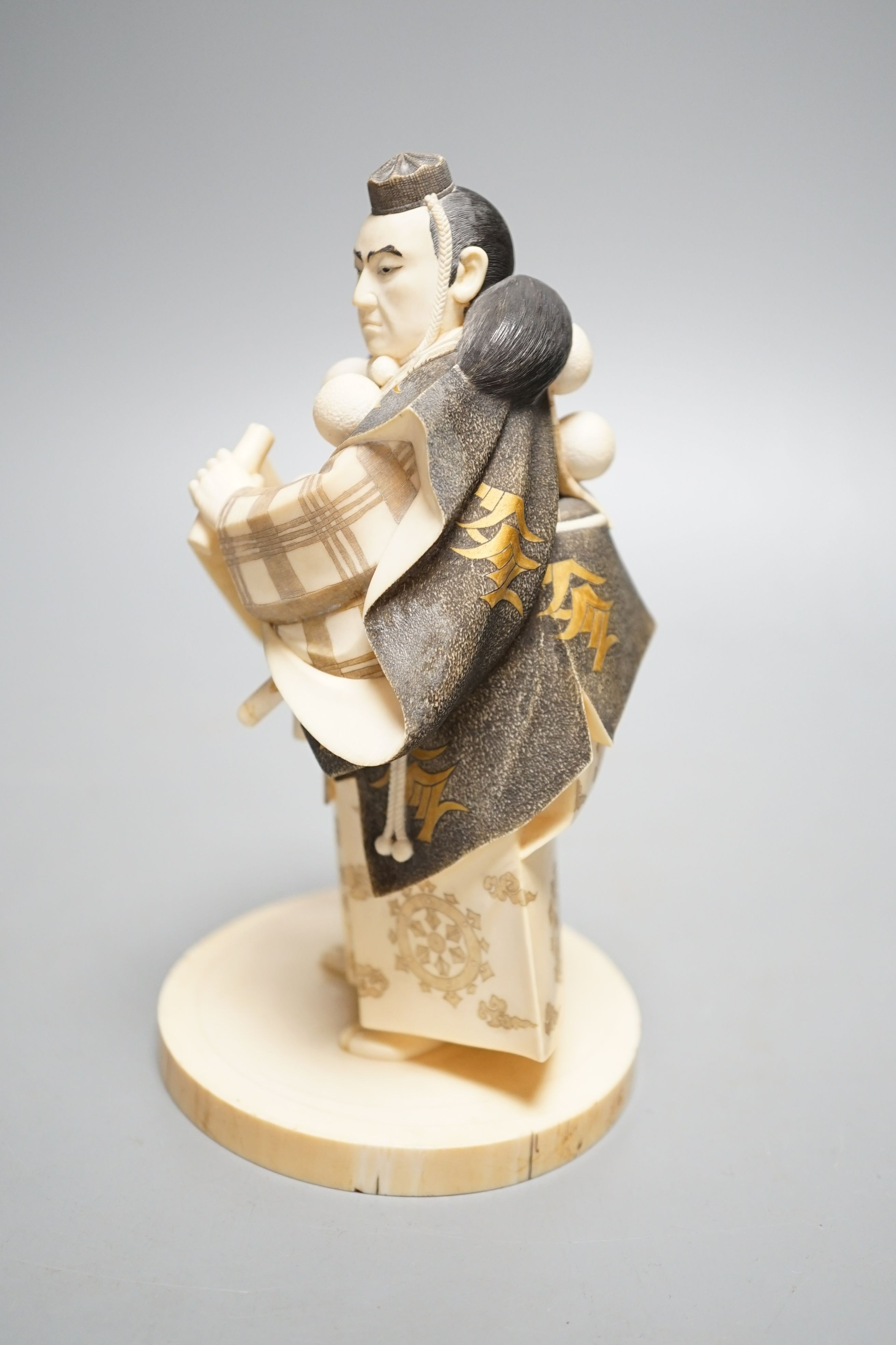 A Japanese ivory figure of a Yamabushi warrior monk, Taisho/early Showa period, signed to a lacquer tablet - 18.5cm tall